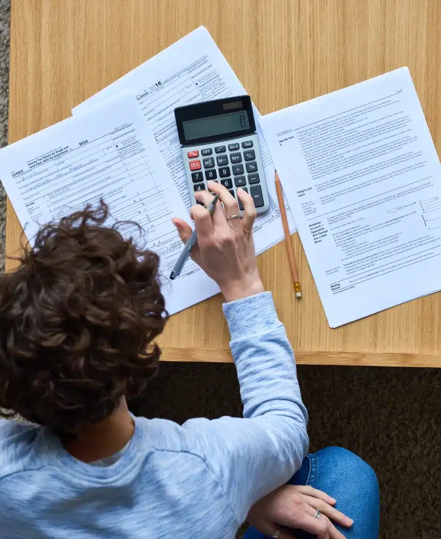 Corporate tax accountant reviewing business financial statements before preparing a T2 corporate tax return